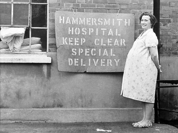 A woman standing at a parking space at Hammersmith Hospital. November 1969 Z11091