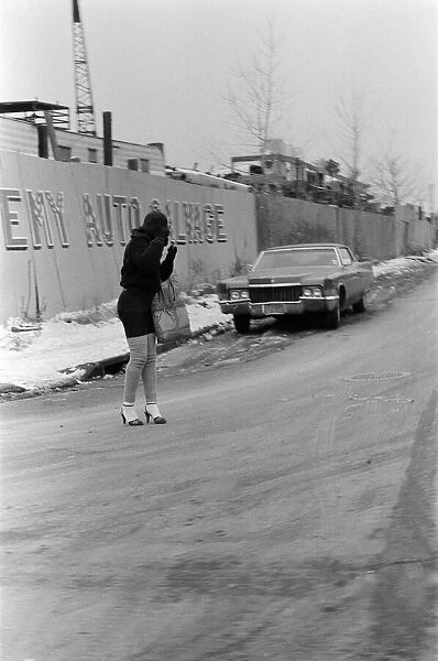 A woman standing in the road in New York. 13th February 1981