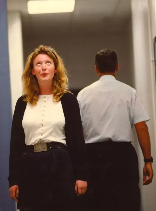 Framed Print : A woman swoons over a male colleague