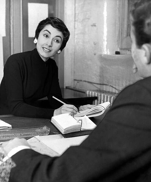 Woman taking dictation, 1955 Secretary office worker