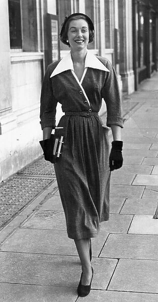 A woman walking along street showing off the latest in fashion