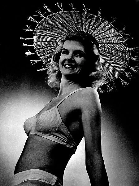 Woman wearing a bikini and hat April 1953 P017639