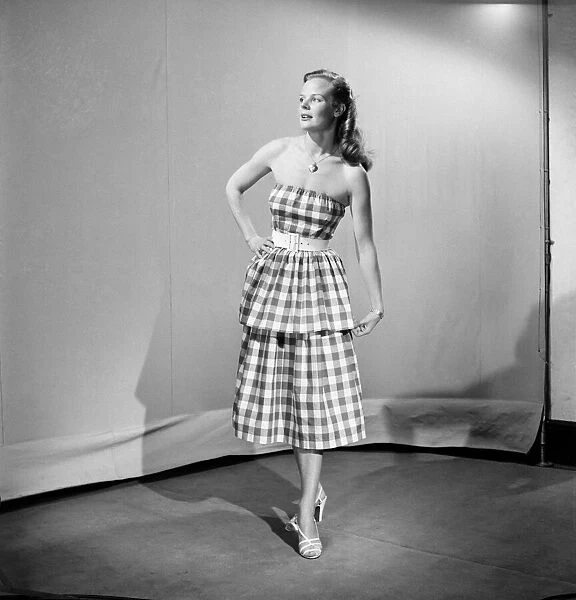 Woman wearing checked dress October 1952 C5178-001