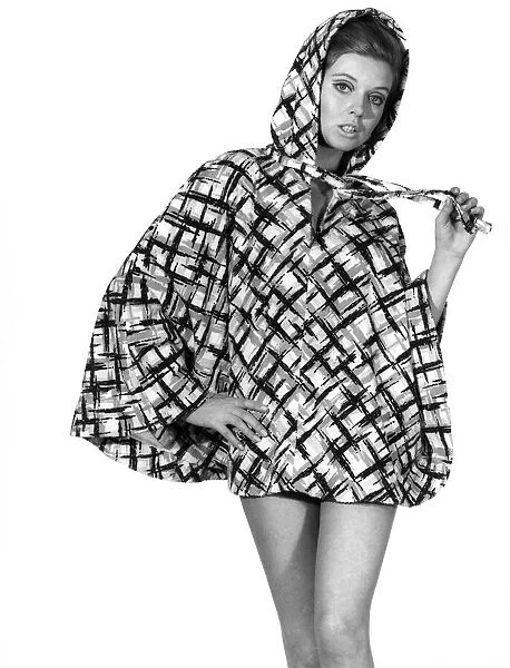 Woman wearing checked jumper. Reveille Fashions. Maureen Walker. April 1967 P008532