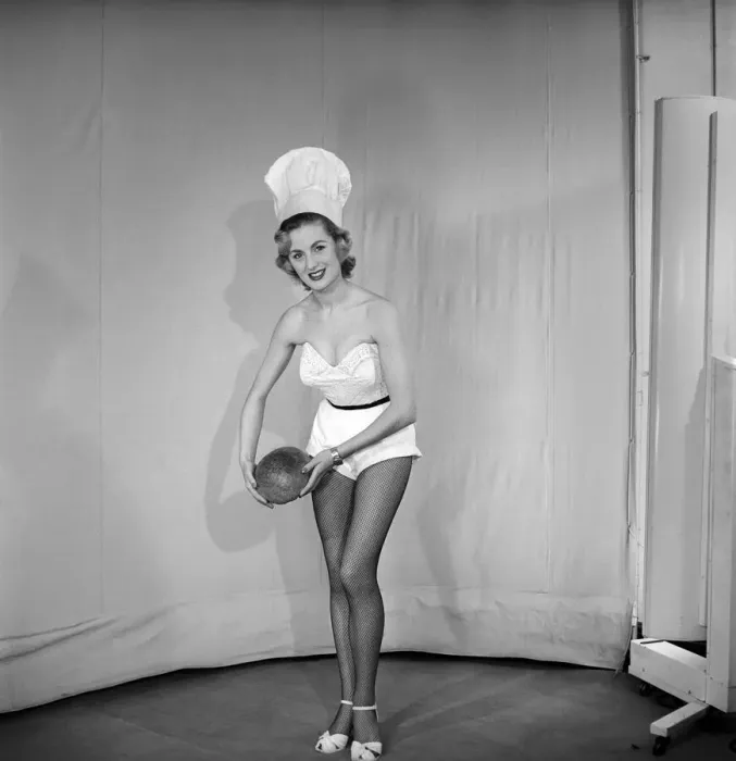 Framed Print : Woman wearing chefs hat holding loaf of bread. 1959 E61-005 Framed Print : Woman wearing chefs hat holding loaf of bread. 1959 E61-005