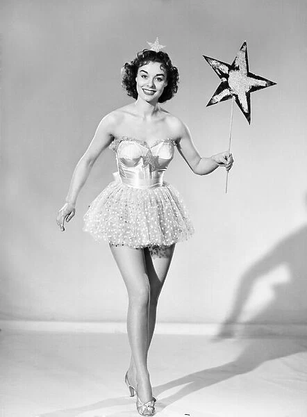 Woman wearing Christmas fairy fancy dress. 1959