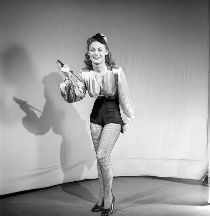 Framed Print : Woman wearing fancy dress jockey outfit. 1959