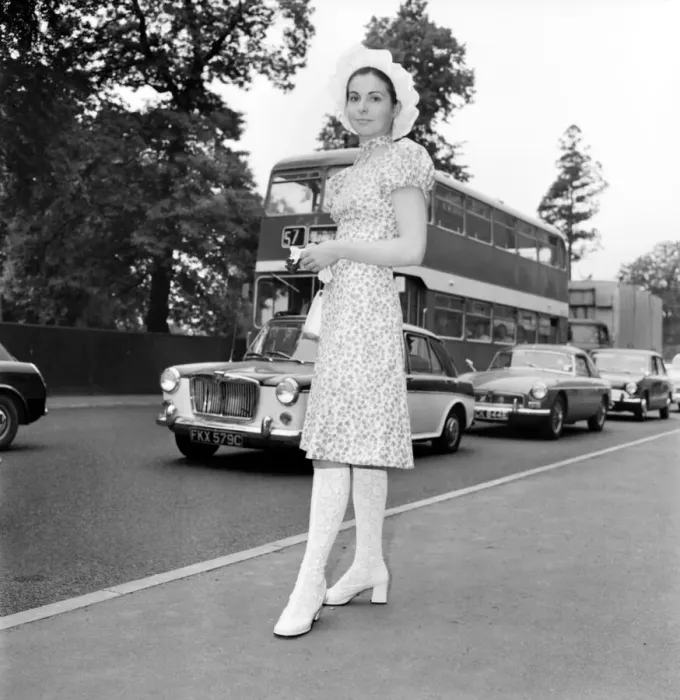 Framed Print : Woman wearing floral patterned knee length dress with hat on the first day of Royal Framed Print : Woman wearing floral patterned knee length dress with hat on the first day of Royal
