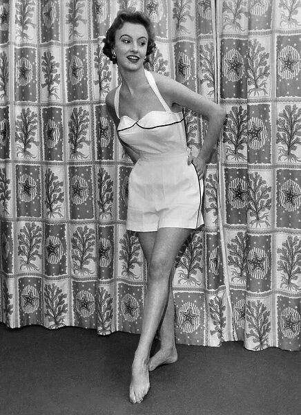 Woman wearing a halterneck playsuit November 1953 P017637