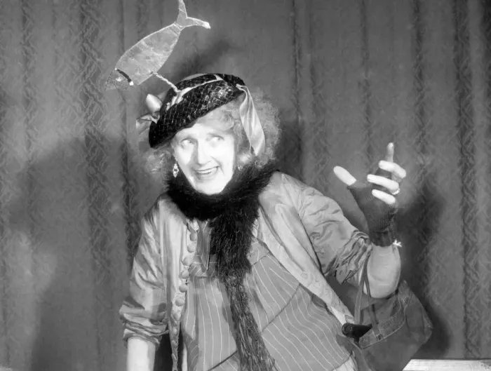 Framed Print : Woman wearing a hat with a fish on it. Singer performing on stage