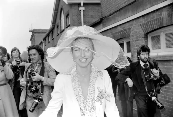 Framed Print : Woman wearing a large hatduring the second day of races at Ascot today