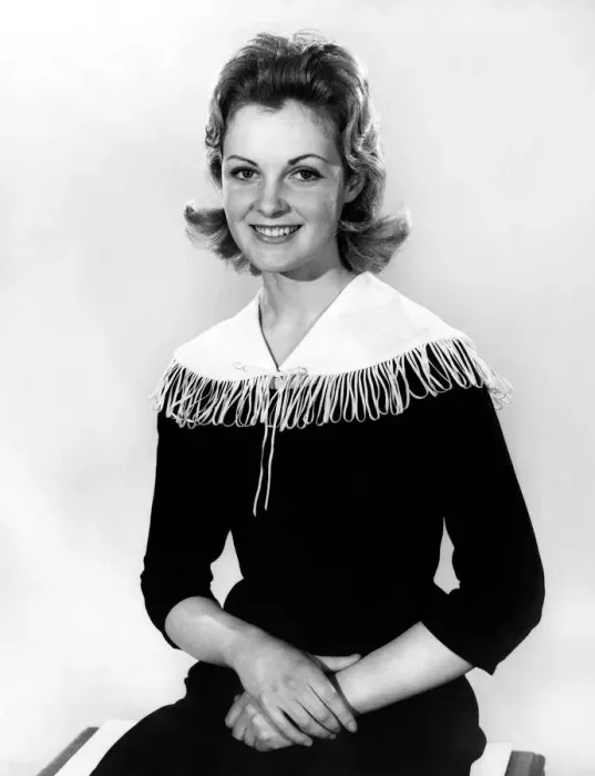 Framed Print : Woman wearing long dress with tassle ffefature around the collar Framed Print : Woman wearing long dress with tassle ffefature around the collar