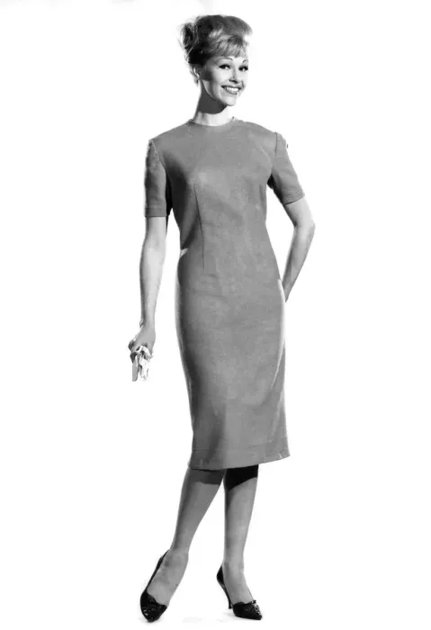 Framed Print : Woman wearing long, straight dress. Reveille Fashions. Jo Wanning. October 1962 P008864 Framed Print : Woman wearing long, straight dress. Reveille Fashions. Jo Wanning. October 1962 P008864