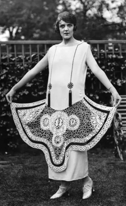 Framed Print : Woman wearing long white dress with circular patterns, Clothing. May 1924 P008661 Framed Print : Woman wearing long white dress with circular patterns, Clothing. May 1924 P008661