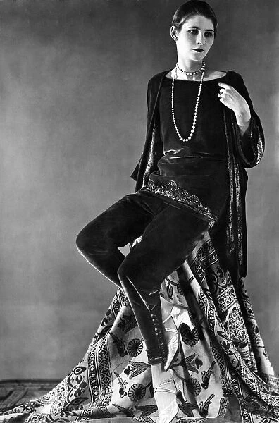 Woman wearing matching velvet top and trousers with beads October 1925