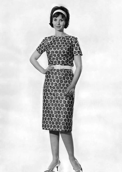 Woman wearing a patterned dress. May 1962 P011066