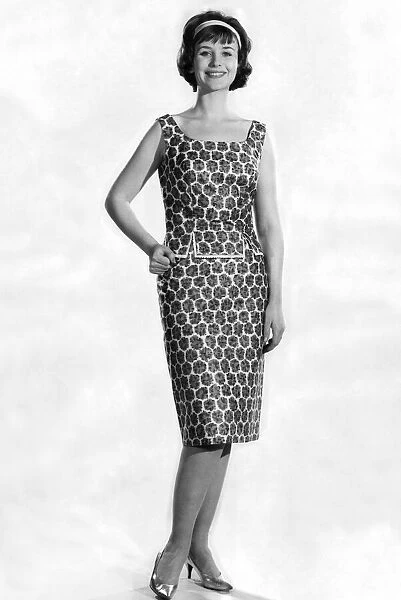 Woman wearing a patterned dress. May 1962 P011067