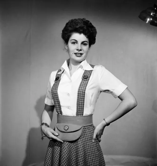 Framed Print : Woman wearing a pinafore dress and holding a purse November 1952 C6272 Framed Print : Woman wearing a pinafore dress and holding a purse November 1952 C6272
