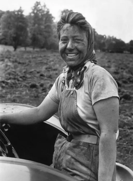 Framed Print : A woman at work cultivating rich black farmland soil in the English countryside Framed Print : A woman at work cultivating rich black farmland soil in the English countryside
