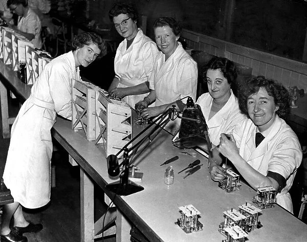 Woman workers in a Manchester electronics factory L-R Olive Birchall, Miss Minnie Slater