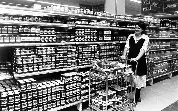 A woman working in Hintons supermarket, Redcar. 26th October 1981
