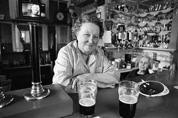 A woman working in a pub in Salford, Manchester, 16th July 1974