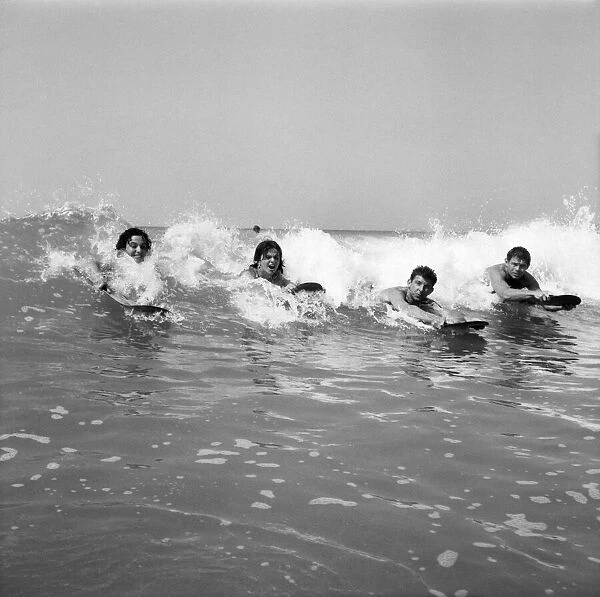 Women body boarding in the surf at Newquay June 1960 M4303-003
