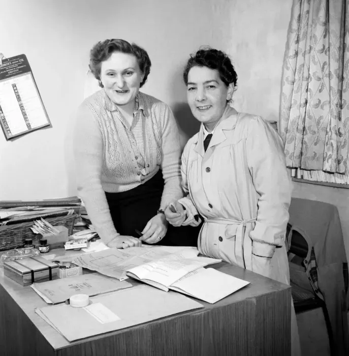 Framed Print : Women carpenters checking the records in their office. 1954 A95-002 Framed Print : Women carpenters checking the records in their office. 1954 A95-002