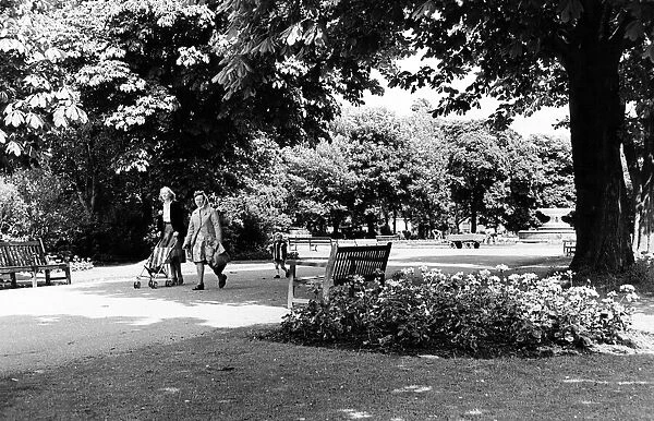 Two women and a child walking through Albert Park in Middlesbrough. 26th June 1979