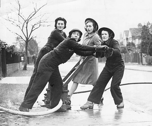 Women firefighters in action. 23rd January 1941