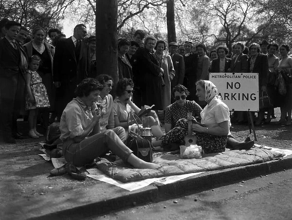 Women having a meal on a mattress in The Mall, waiting for the Royal wedding