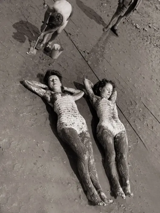 Framed Print : Women Holidaymakers sunbathing on the wet sand wearing swimming costumes bathing suits Framed Print : Women Holidaymakers sunbathing on the wet sand wearing swimming costumes bathing suits
