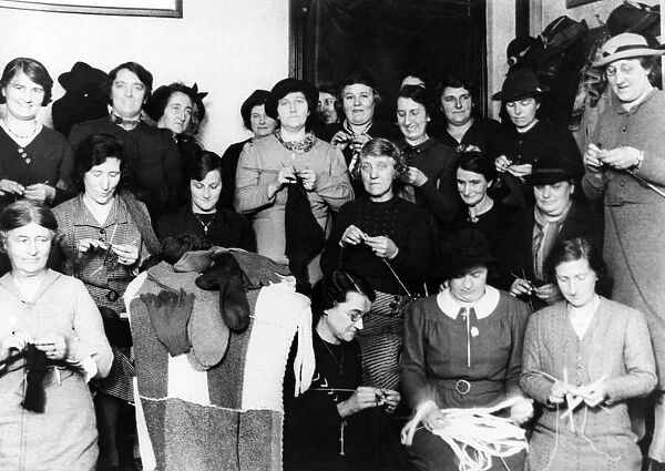 Women kitting comforts for the forces of the British Legion