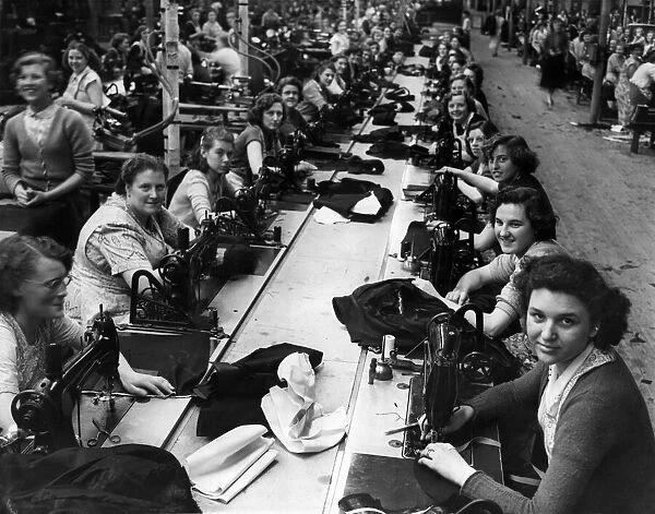 Women manufacturing clothing on a production line. October 1954 P000015