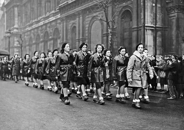 Women members of the French Forces of the Interior march up Whitehall after placing a