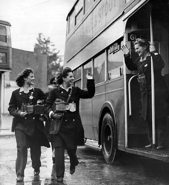 Women in mens jobs during World War Two. Bus conductor Mrs Margaret Leonard waves to her