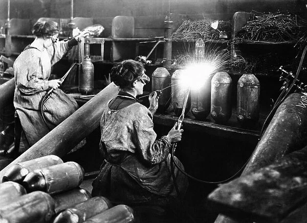Women munition workers at munition factory, manufacturing bombs. March 1916