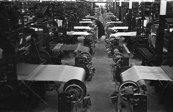 Women operating looms at a Milan mill. Circa 1955