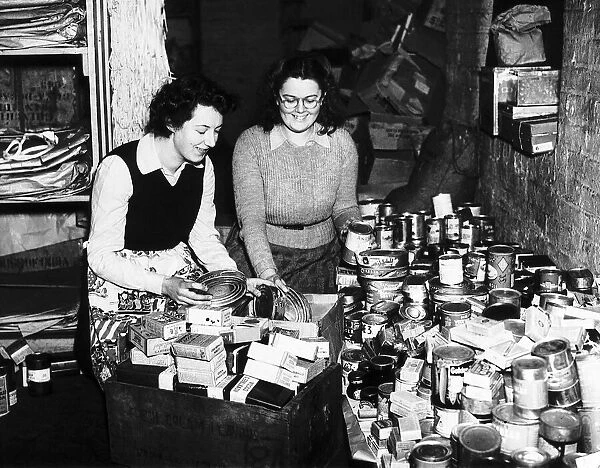 Women pack cans of food to be sent to troops in Europe during WW2 1944
