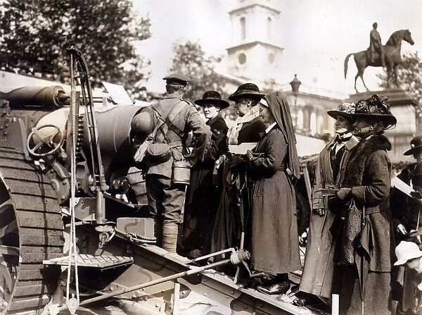 Women queue fo buy war bonds at Trafalgar Square. A Soldier stands by a tank promoting