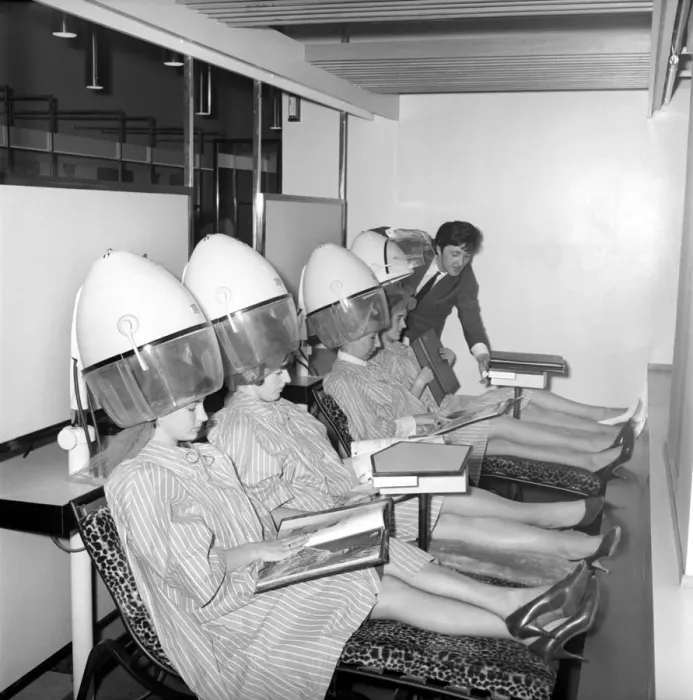 Framed Print : Women reading magazines at the John London Hair and Beauty Saloon whilst under the driers Framed Print : Women reading magazines at the John London Hair and Beauty Saloon whilst under the driers