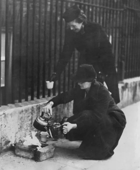 Framed Print : Women residents of London making themselves a little fire for a morning cup of tea in Framed Print : Women residents of London making themselves a little fire for a morning cup of tea in