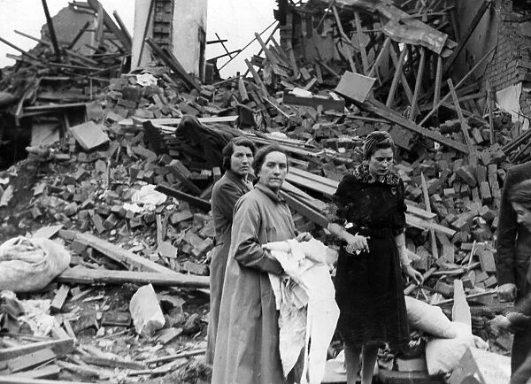 Women salvaging their belongings from their homes following an air raid in Rogerstone