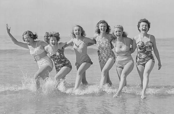 Women seen here playing on Fistral beach Newquay. 30th May 1952