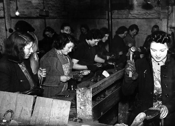 Women shoemakers in England during World War II. Circa 1941