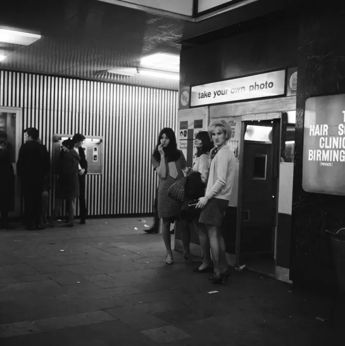 Framed Print : Women standing outside a photo booth in Birmingham, West Midlands. 4th October 1967 Framed Print : Women standing outside a photo booth in Birmingham, West Midlands. 4th October 1967