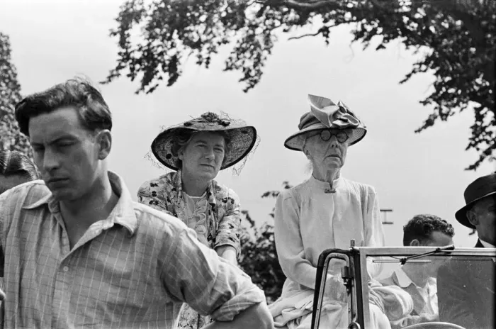 Framed Print : Two women watching an event during Canterbury Week, Kent, August 1947 Framed Print : Two women watching an event during Canterbury Week, Kent, August 1947