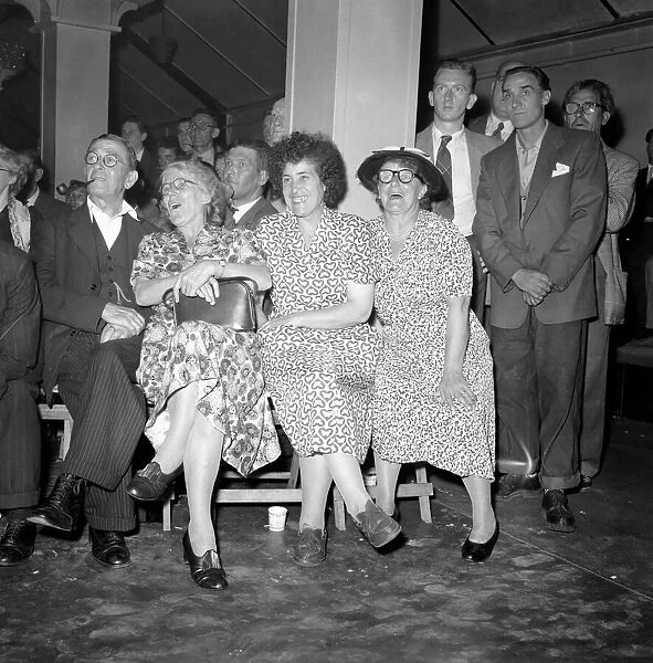 Women watching the wrestling at Wimbledon town hall. May 1953 D5264-001