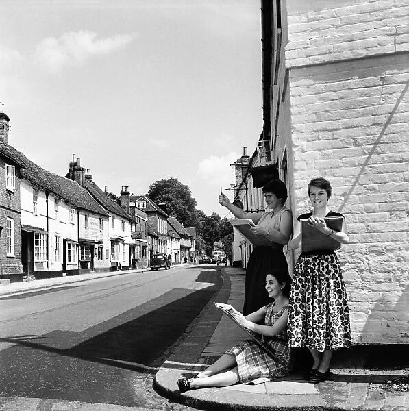 Women of West Wycombe in Buckinghamshire standing in the street making sketches of local
