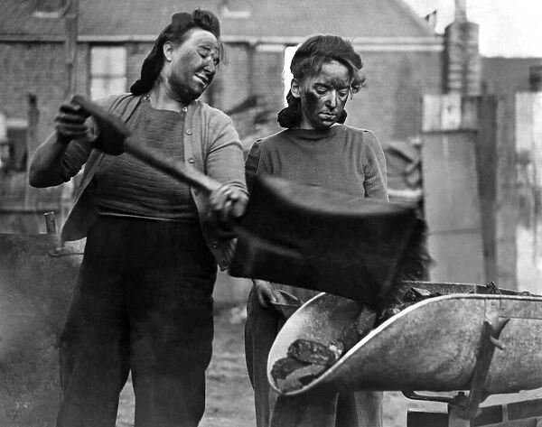 Two women who were serving coal at the emergency coal dump at Chiswick